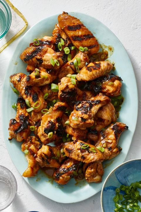 grilled chicken wings topped with sliced scallions